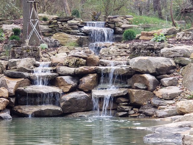 Water feature with hardscaping with glacier stones